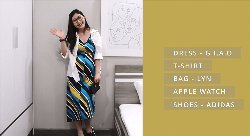 Outfit mẹ bầu kết hợp giữa đầm hai dây, áo sơ mi trắng, túi xách và đồng hồ apple